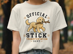 White t-shirt with a golden retriever carrying a stick, "Official Stick Transportation Dept." text.