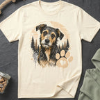 Cream t-shirt with a scruffy dog illustration, pine trees, and a paw print with heart.