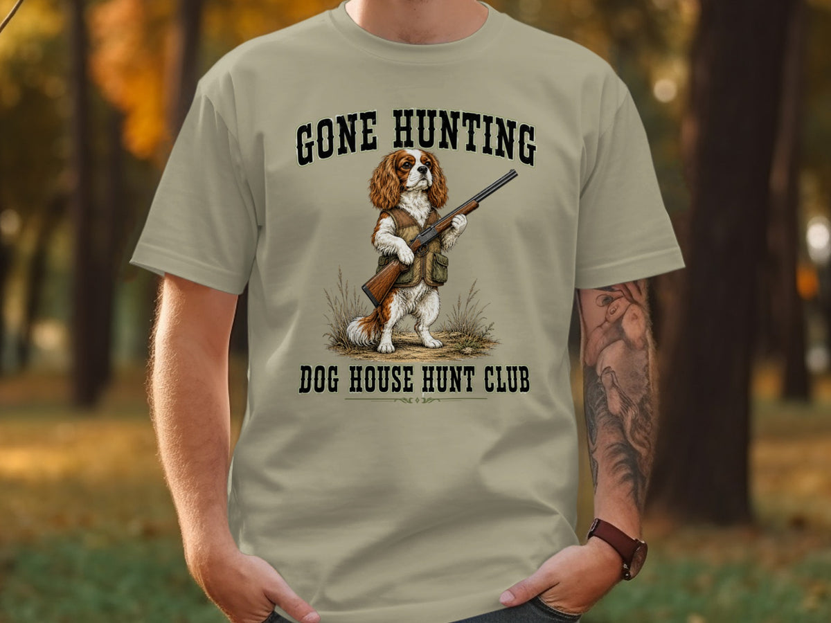 T-shirt graphic of a dog with a shotgun, reading "Gone Hunting Dog House Hunt Club".