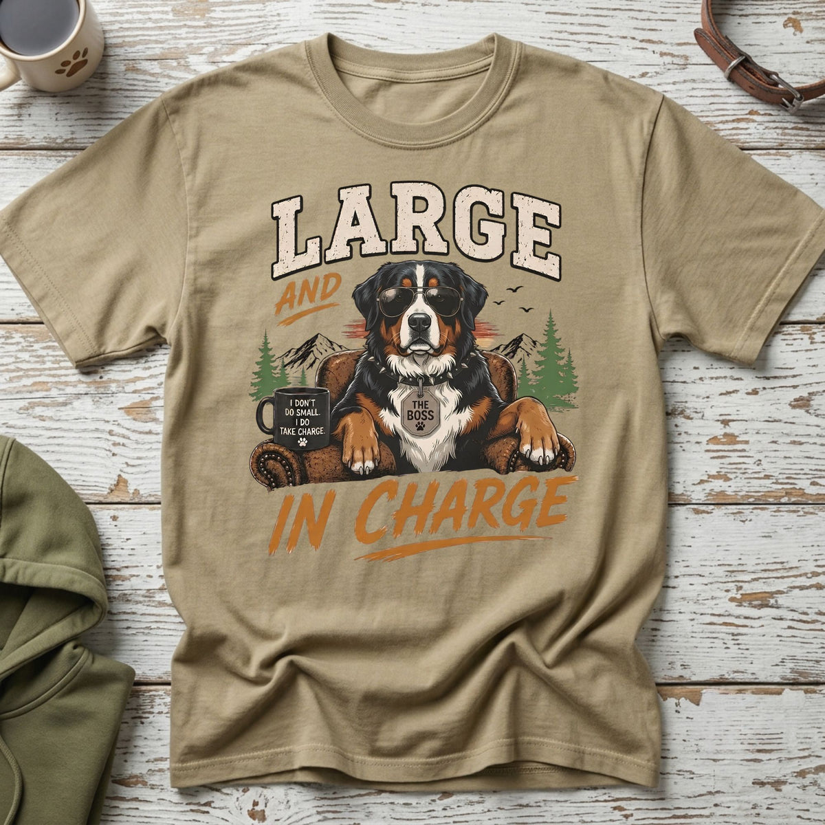 Bernese Mountain Dog wearing sunglasses and a tag that says "THE BOSS" on a t-shirt that reads "LARGE AND IN CHARGE."