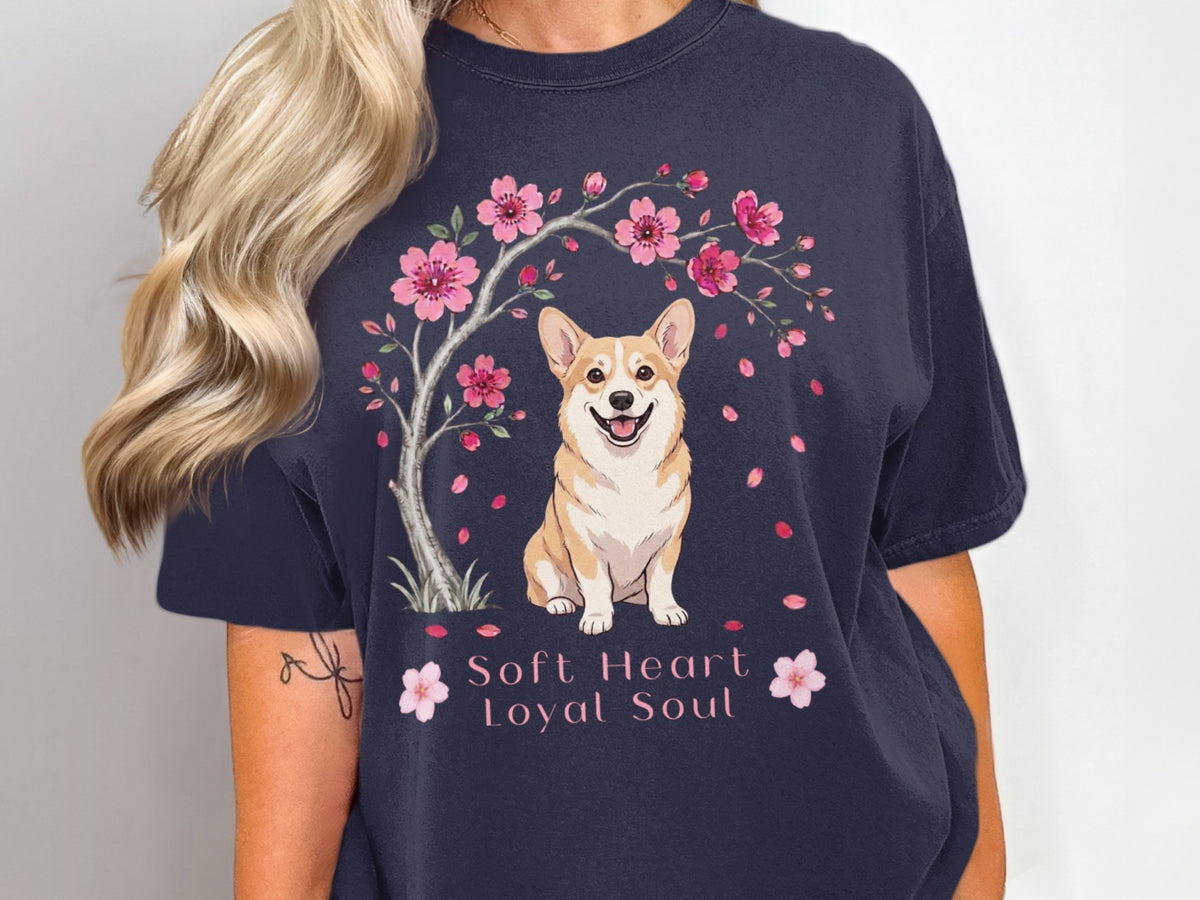 Navy t-shirt with a corgi sitting under a cherry blossom tree.