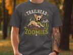 T-shirt graphic of a dog running with a stick, "TRAILHEAD ZOOMIES" text, mountains and trees.