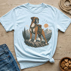 Light blue t-shirt with a graphic of a boxer dog wearing a backpack in a mountain landscape.