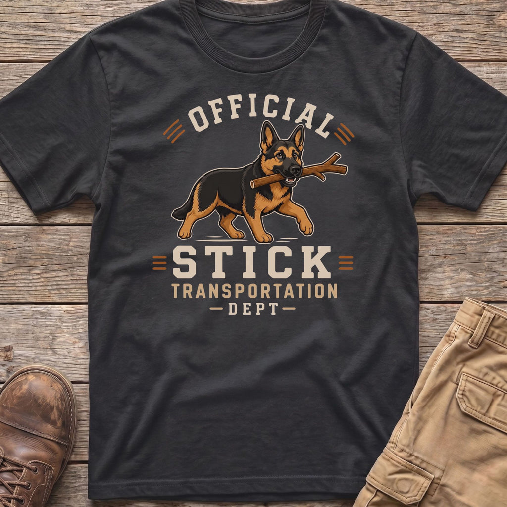 German Shepherd with stick on shirt reads "Official Stick Transportation - Dept -"