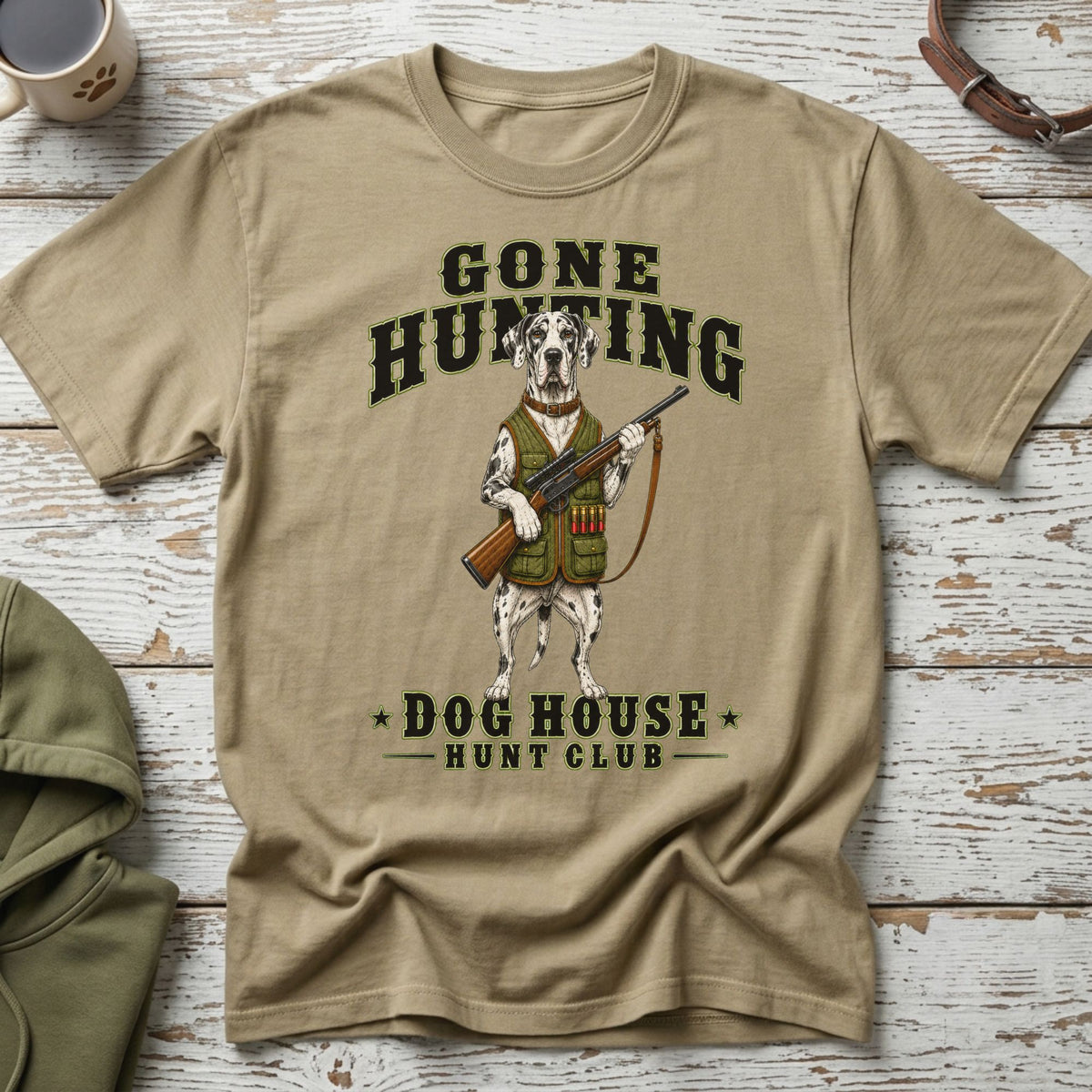Dalmatian dog in hunting vest holding rifle with text "GONE HUNTING DOG HOUSE HUNT CLUB".