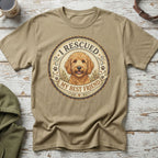 Tan t-shirt with circular graphic featuring a doodle dog and text "I Rescued My Best Friend."