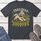 "Trailhead Zoomies" text above a dog running with a stick, mountains and trees.