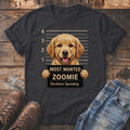 Dark t-shirt with Golden Retriever in mugshot holding a sign reading "Most Wanted Zoomie"