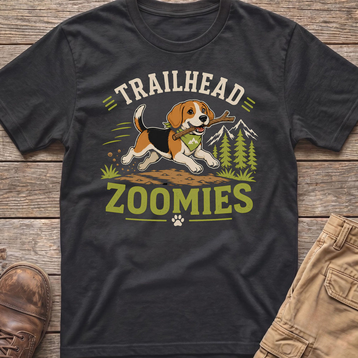 T-shirt graphic with a beagle dog holding a stick, text "TRAILHEAD ZOOMIES", and mountains.