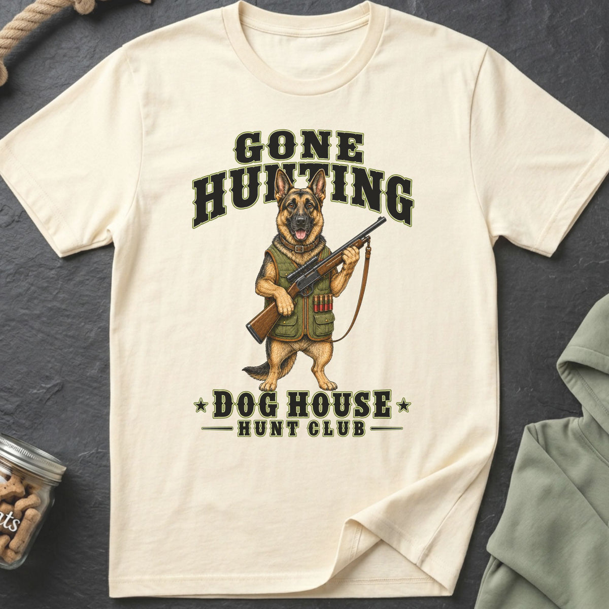 German Shepherd with rifle and "Gone Hunting Dog House Hunt Club" text on cream t-shirt.