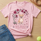 Pink t-shirt with a cheerful chihuahua under a blooming cherry blossom tree.