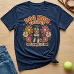 Navy t-shirt with "Dog Mom Energy" and a schnauzer surrounded by retro flowers.