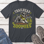 Schnauzer with stick running on a trail with text "TRAILHEAD ZOOMIES"