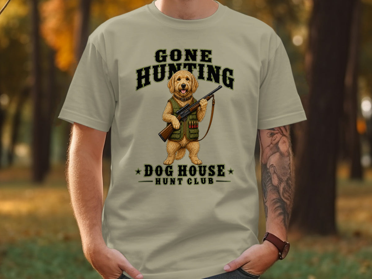 T-shirt with a dog holding a rifle and text "Gone Hunting Dog House Hunt Club".