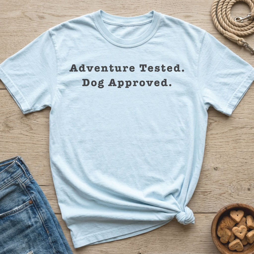Light blue t-shirt with "Adventure Tested. Dog Approved." text.