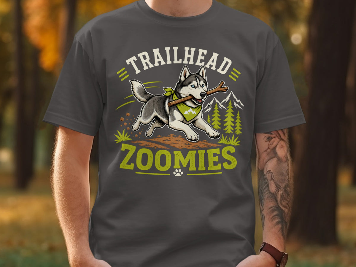 Husky running with stick, "Trailhead Zoomies" text, mountains, and trees graphic.
