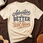 Cream t-shirt with "Adventure is Better with Wet Noses" graphic.