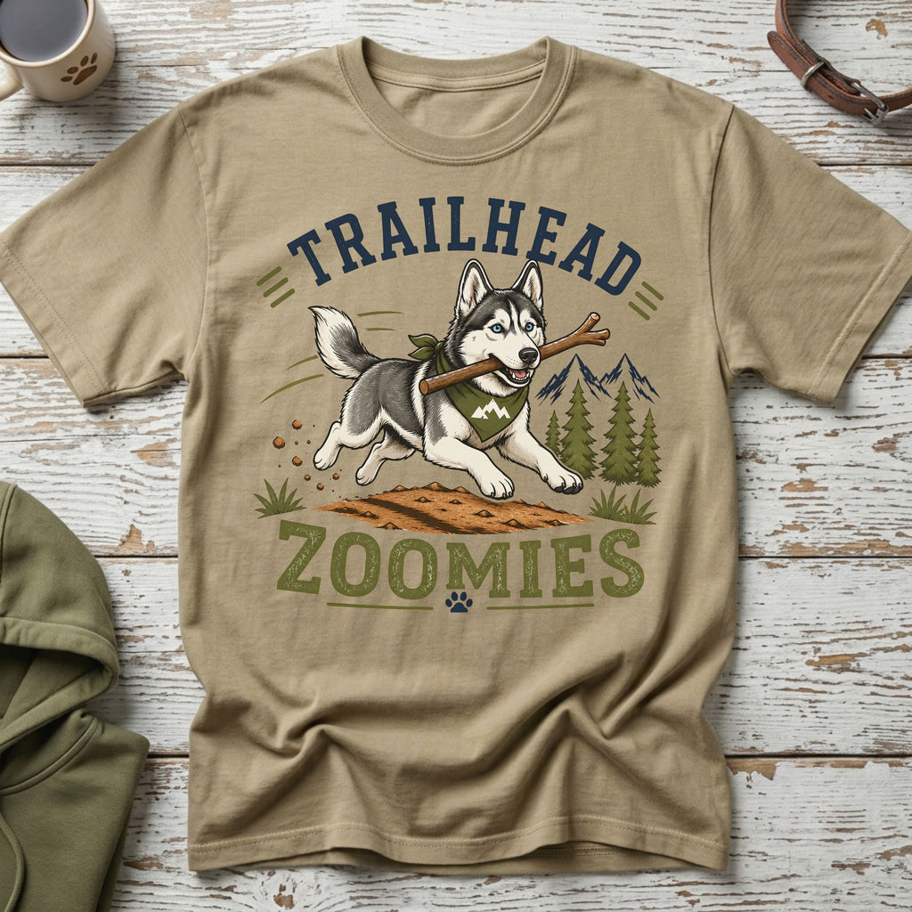 Husky with stick on shirt text "TRAILHEAD ZOOMIES" with mountain graphic
