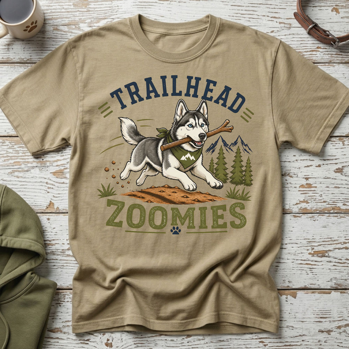 Husky with stick on shirt text "TRAILHEAD ZOOMIES" with mountain graphic