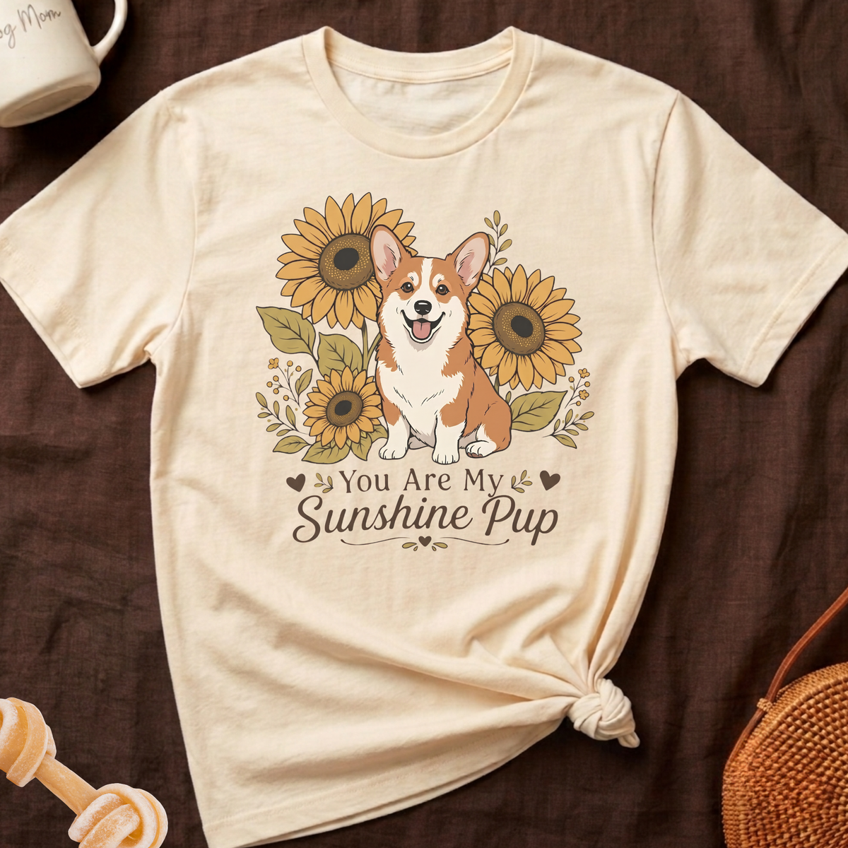 Cream t-shirt with a Corgi and sunflowers. Text reads "You Are My Sunshine Pup".
