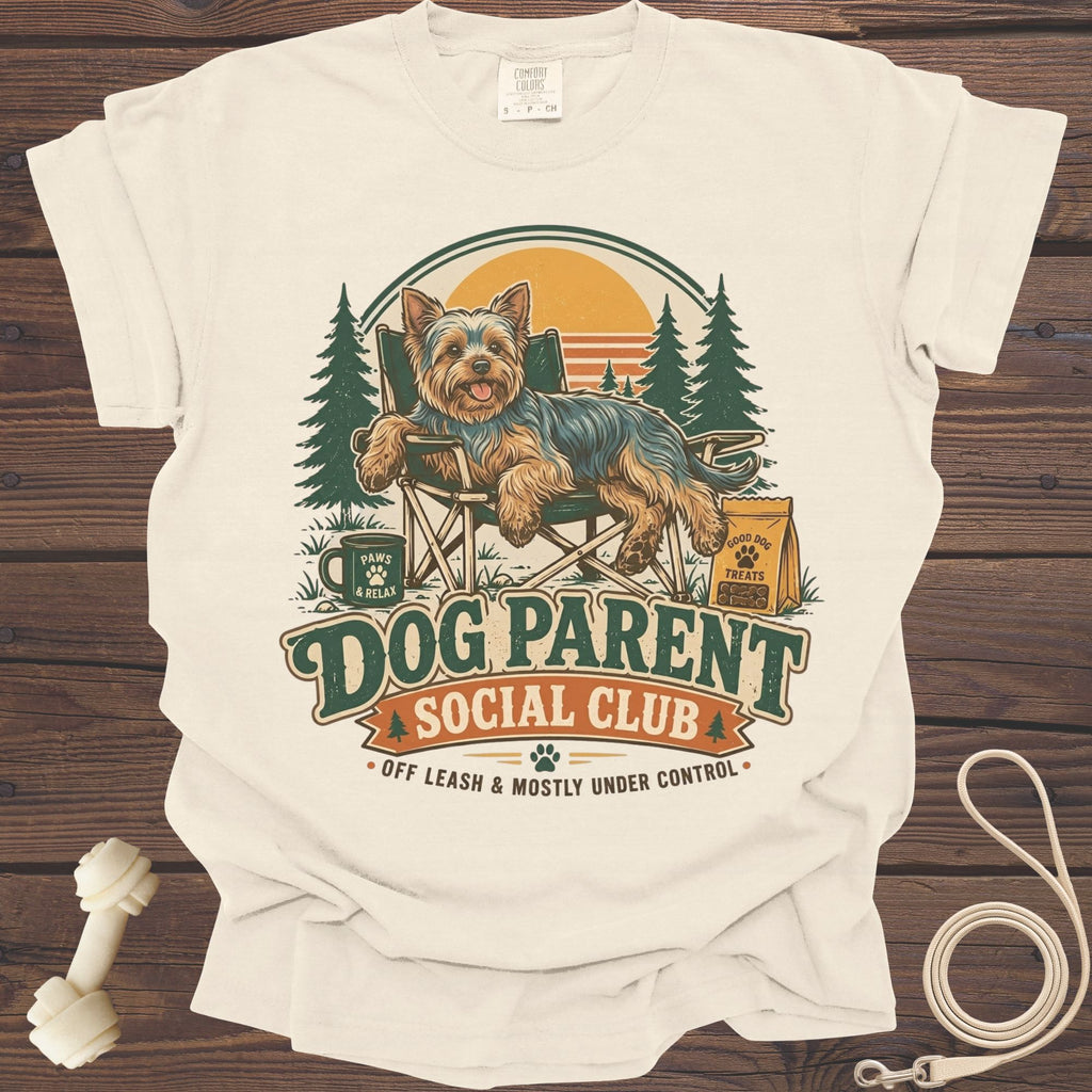 Yorkshire Terrier sitting in a chair with "Dog Parent Social Club" text.