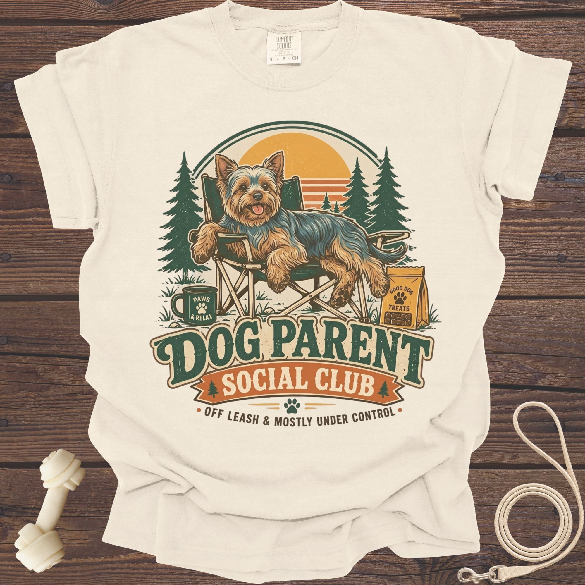 Yorkshire Terrier sitting in a chair with "Dog Parent Social Club" text.