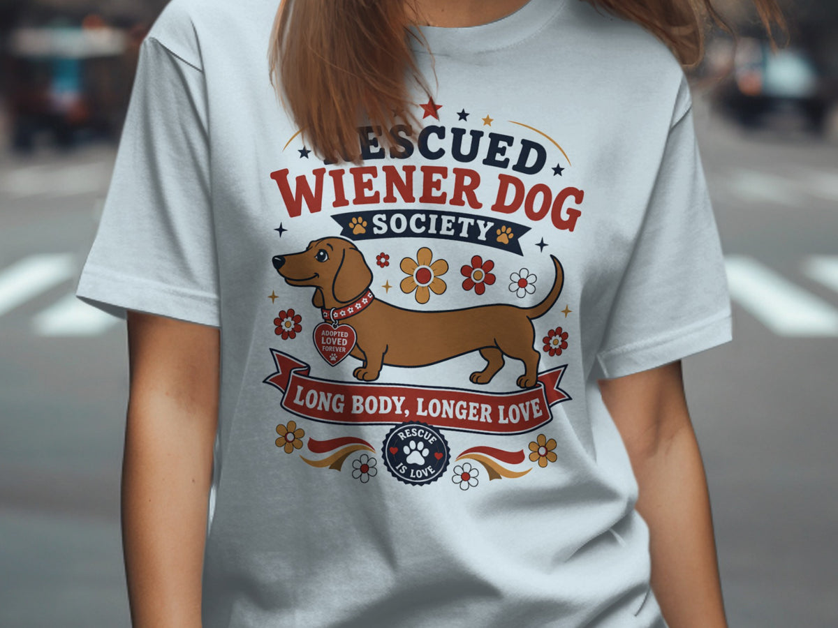 White t-shirt with rescued wiener dog society graphic and "Long body, longer love" text.