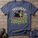 Bernese mountain dog with stick, text "TRAILHEAD ZOOMIES" on a blue t-shirt.