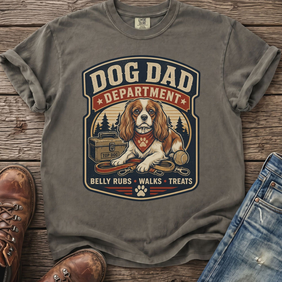 Dog Dad Department shirt featuring a dog with a bandana, leash, and treat box.