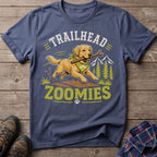 Golden Retriever dog with stick runs with "TRAILHEAD ZOOMIES" text and mountain background.