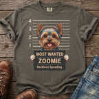 Yorkshire Terrier in mugshot with "Most Wanted Zoomie" sign reading "Reckless Speeding."