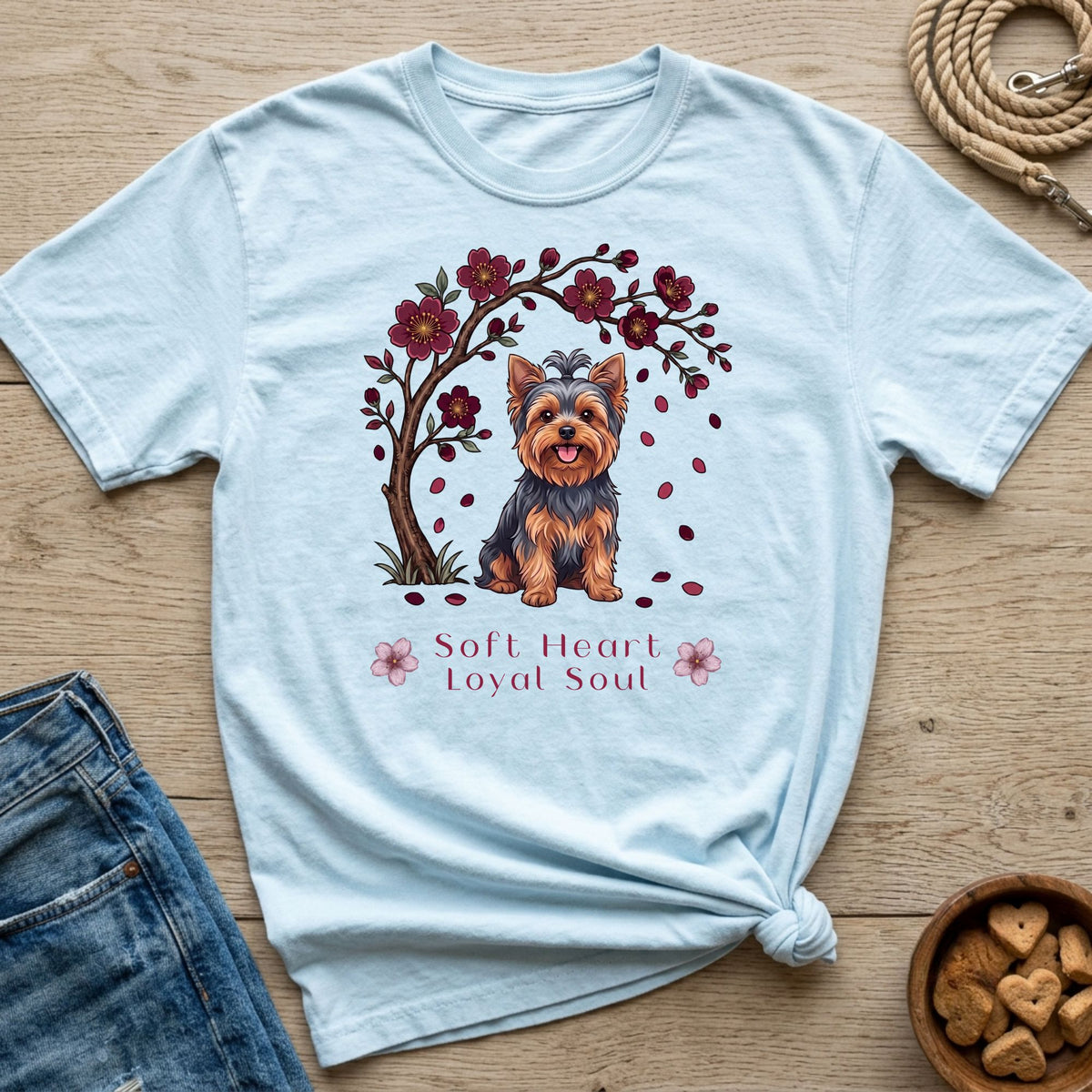 Light blue t-shirt with a Yorkshire Terrier under a blooming cherry tree, text "Soft Heart Loyal Soul".