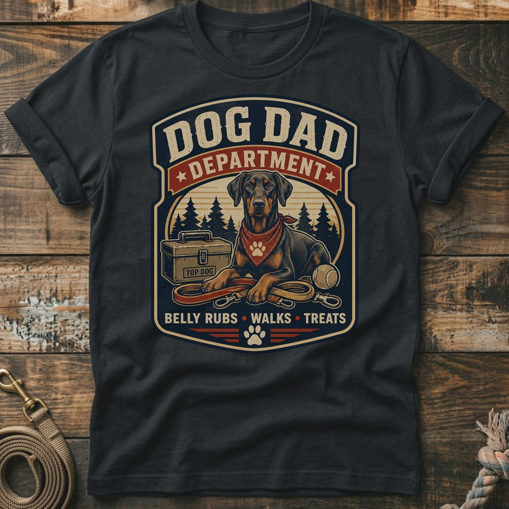 Dark gray t-shirt graphic with Doberman, leash, ball, and text "Dog Dad Department".