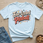 Light blue t-shirt with "Four-Legged Pinball" text and festive dots.