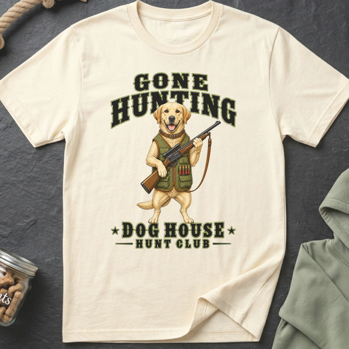 T-shirt with cartoon dog holding a rifle, text says "Gone Hunting Dog House Hunt Club".