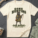 Cream t-shirt with a dog in hunting gear holding a rifle and text.