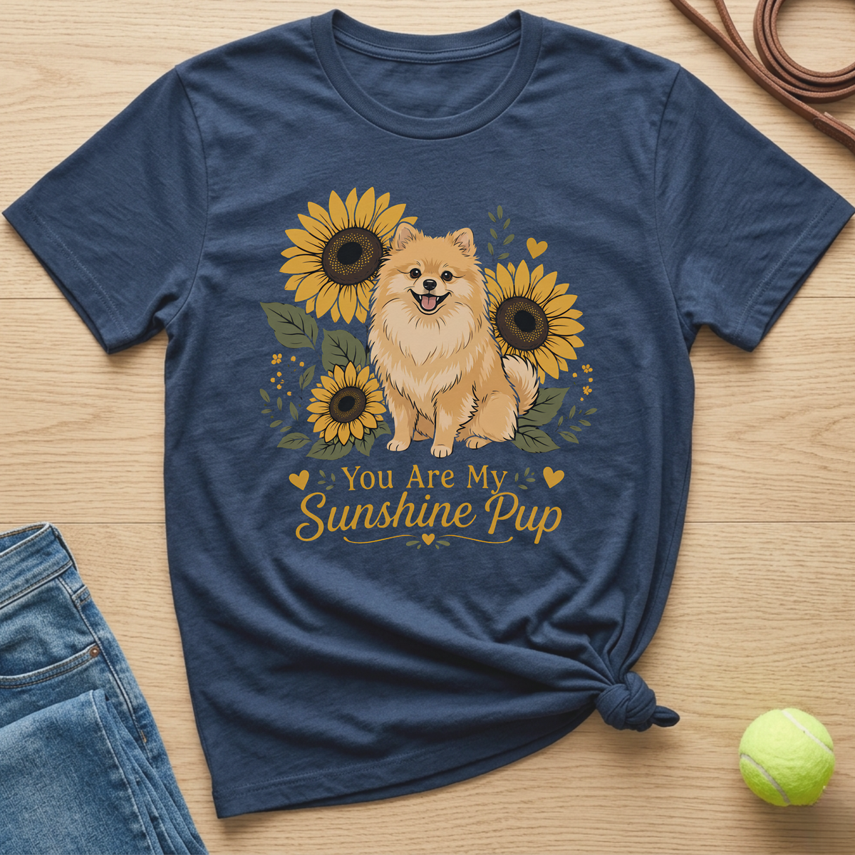 Navy t-shirt with a Pomeranian dog and sunflowers. Text reads "You Are My Sunshine Pup."