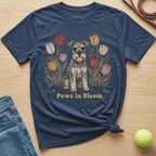 Navy t-shirt with a schnauzer dog surrounded by tulips and text "Paws in Bloom."