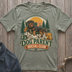Rottweiler relaxing in a camping chair with "Dog Parent Social Club" text.