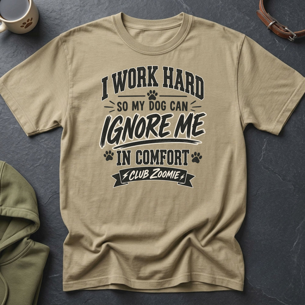 Tan t-shirt with "I work hard so my dog can ignore me in comfort Club Zoomie" text.
