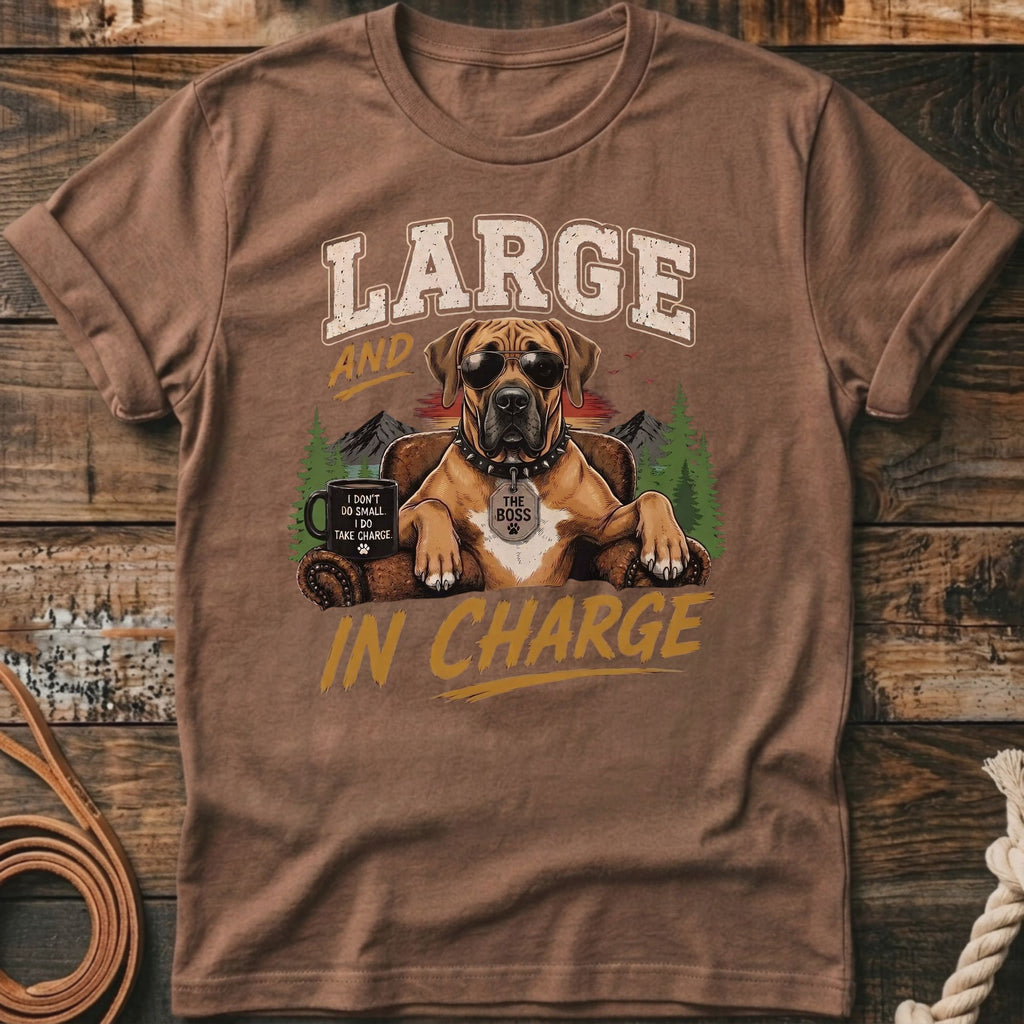 Dog wearing sunglasses sitting in a chair with text "LARGE AND THE BOSS IN CHARGE."