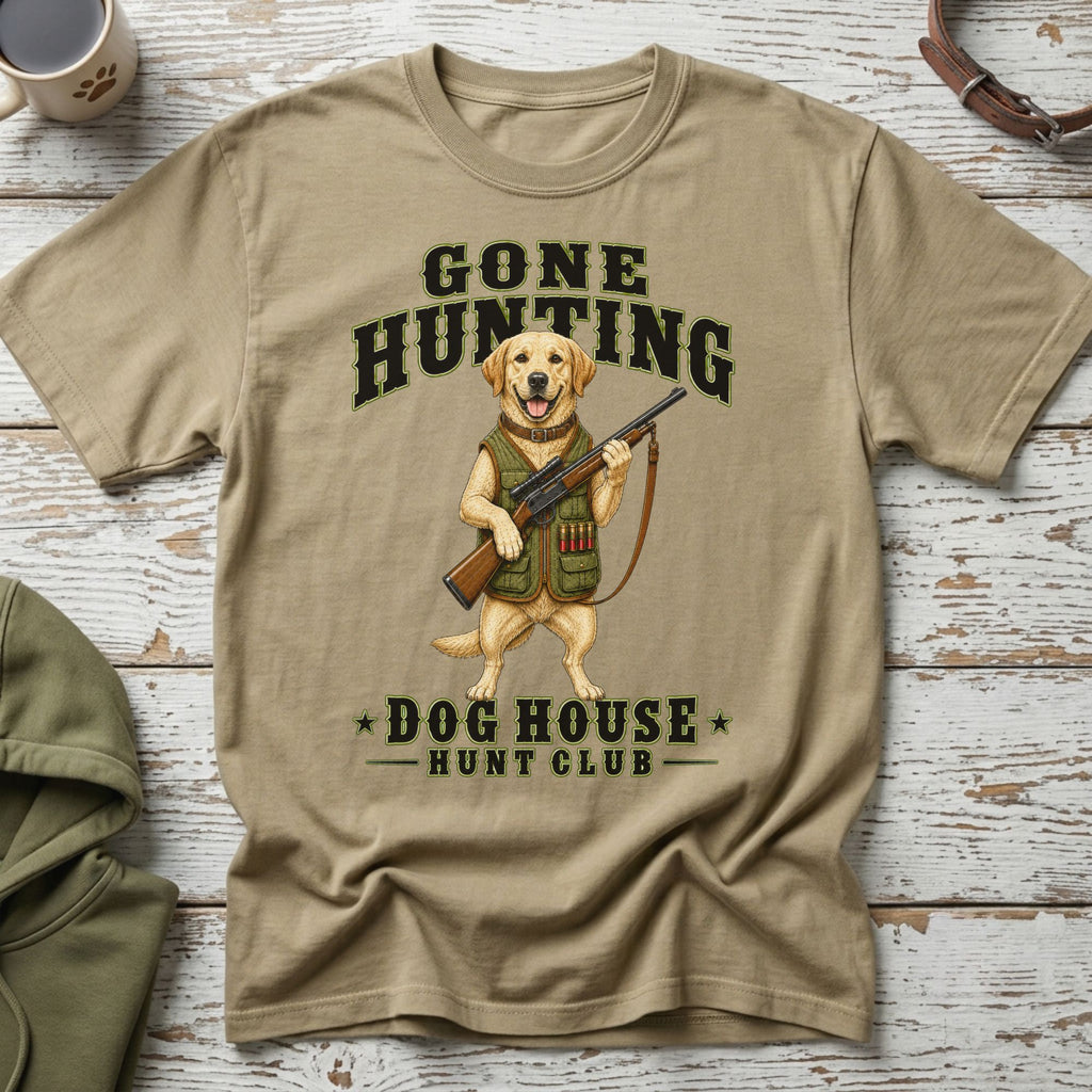 T-shirt graphic of a Labrador dog holding a rifle and wearing hunting gear.