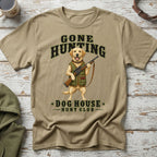 T-shirt graphic of a Labrador dog holding a rifle and wearing hunting gear.