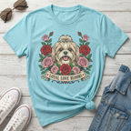 Light blue t-shirt with dog and roses graphic that reads "Loyal Love Blooms".