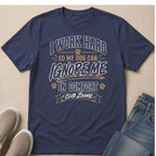 Navy t-shirt with "I WORK HARD SO MY DOG CAN IGNORE ME IN COMFORT CLUB ZOOMIE" text.
