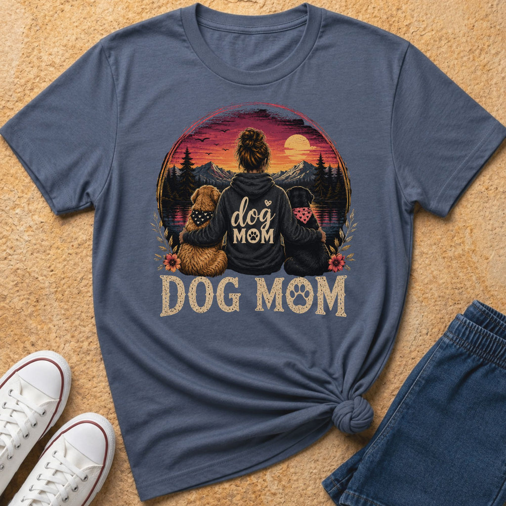 T-shirt with "dog MOM" graphic featuring a woman and two dogs with a sunset landscape.