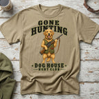 Tan t-shirt with a Golden Retriever holding a hunting rifle and text.
