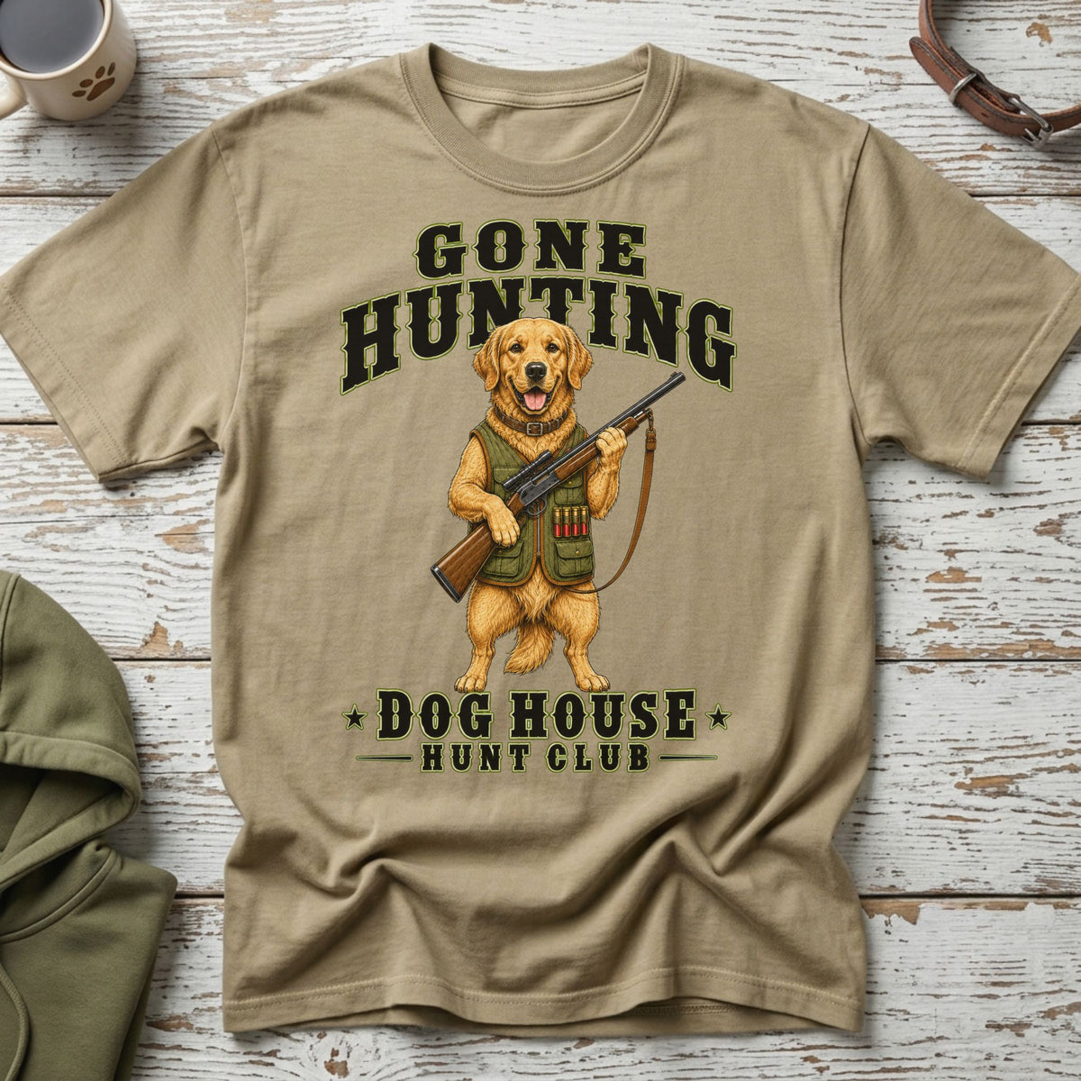 Tan t-shirt with a Golden Retriever holding a hunting rifle and text.
