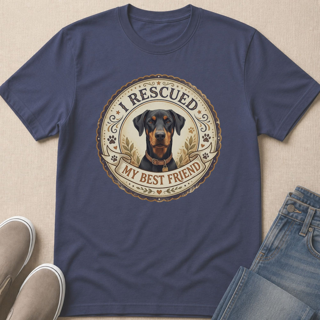 Doberman with text "I RESCUED MY BEST FRIEND" on a navy t-shirt.