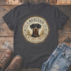 Dark gray t-shirt with a Doberman Pinscher graphic and text "I RESCUED MY BEST FRIEND."